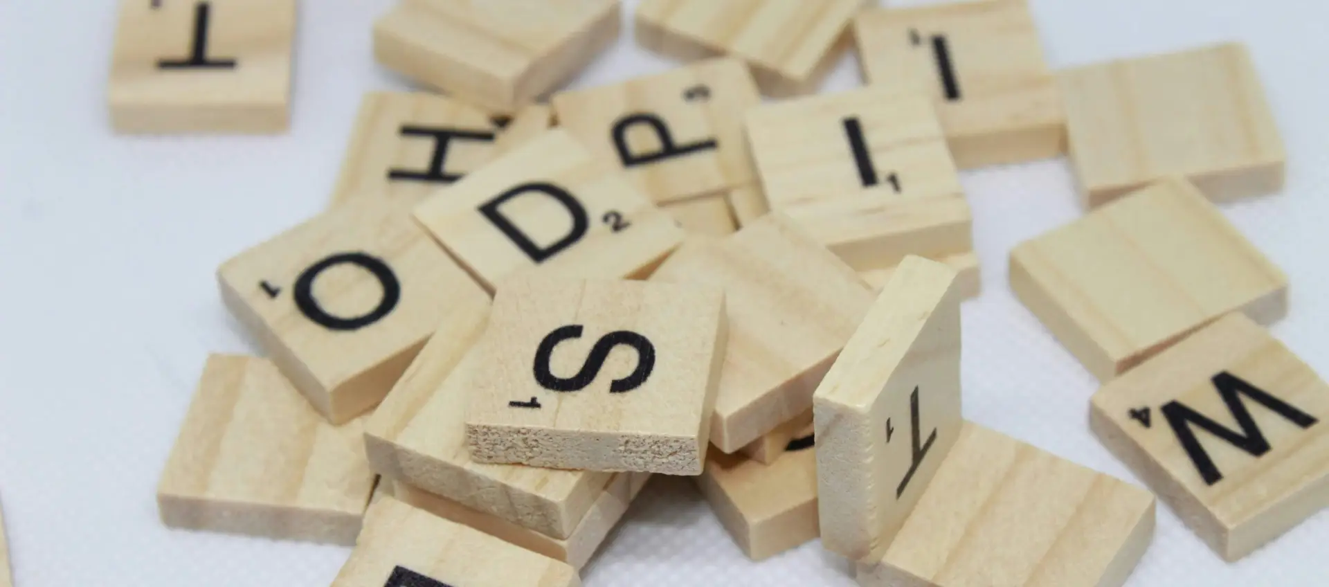 Scrabble tiles on white table